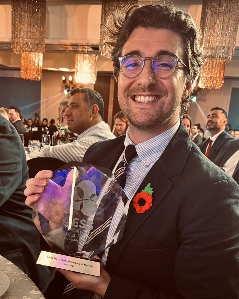 Ryan Bassindale holding the GESS Rising Star trophy at the awards ceremony